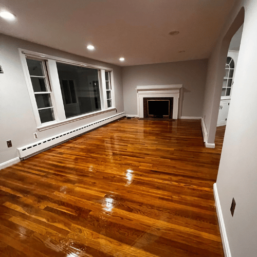 A wooden deck after being power washed and stained.