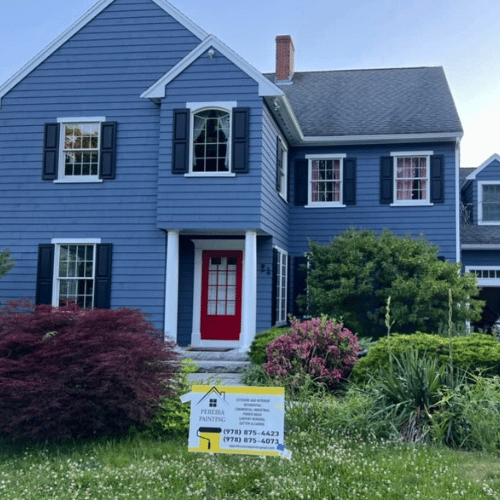 A bright kitchen with newly painted white cabinets.