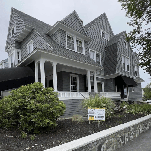 Close-up of a painter cutting in on a wall edge.